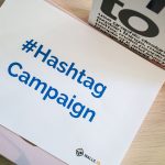 A concept image of a hashtag campaign displayed on paper for marketing strategies. — Surviving Your First Year in Business: T